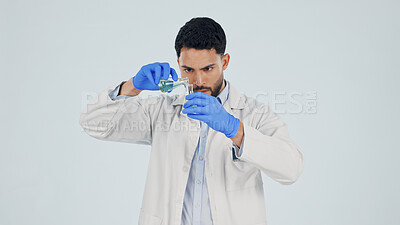 Buy stock photo Scientist, man and pour chemical in beaker at studio for experiment, pharma development and space. Science, chemistry innovation and person with liquid, medical research or study on white background
