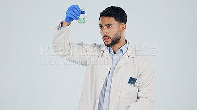 Buy stock photo Scientist, man and chemical beaker for inspection, pharma development and space in studio. Science, chemistry and person with liquid for drug experiment, medical research or study on white background