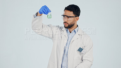Buy stock photo Scientist, man and check chemical beaker for synthesis, pharma development and space in studio. Liquid, chemistry and person with drug experiment, medical research and study on white background