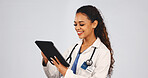Tablet, woman and doctor in studio with research for medical diagnosis, telehealth or treatment. Digital technology, reading and female healthcare worker with online consultation by white background.