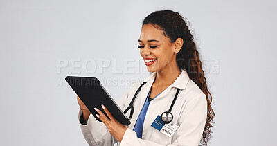 Buy stock photo Tablet, woman and doctor in studio with research for medical diagnosis, telehealth or treatment. Digital technology, reading and female healthcare worker with online consultation by white background.