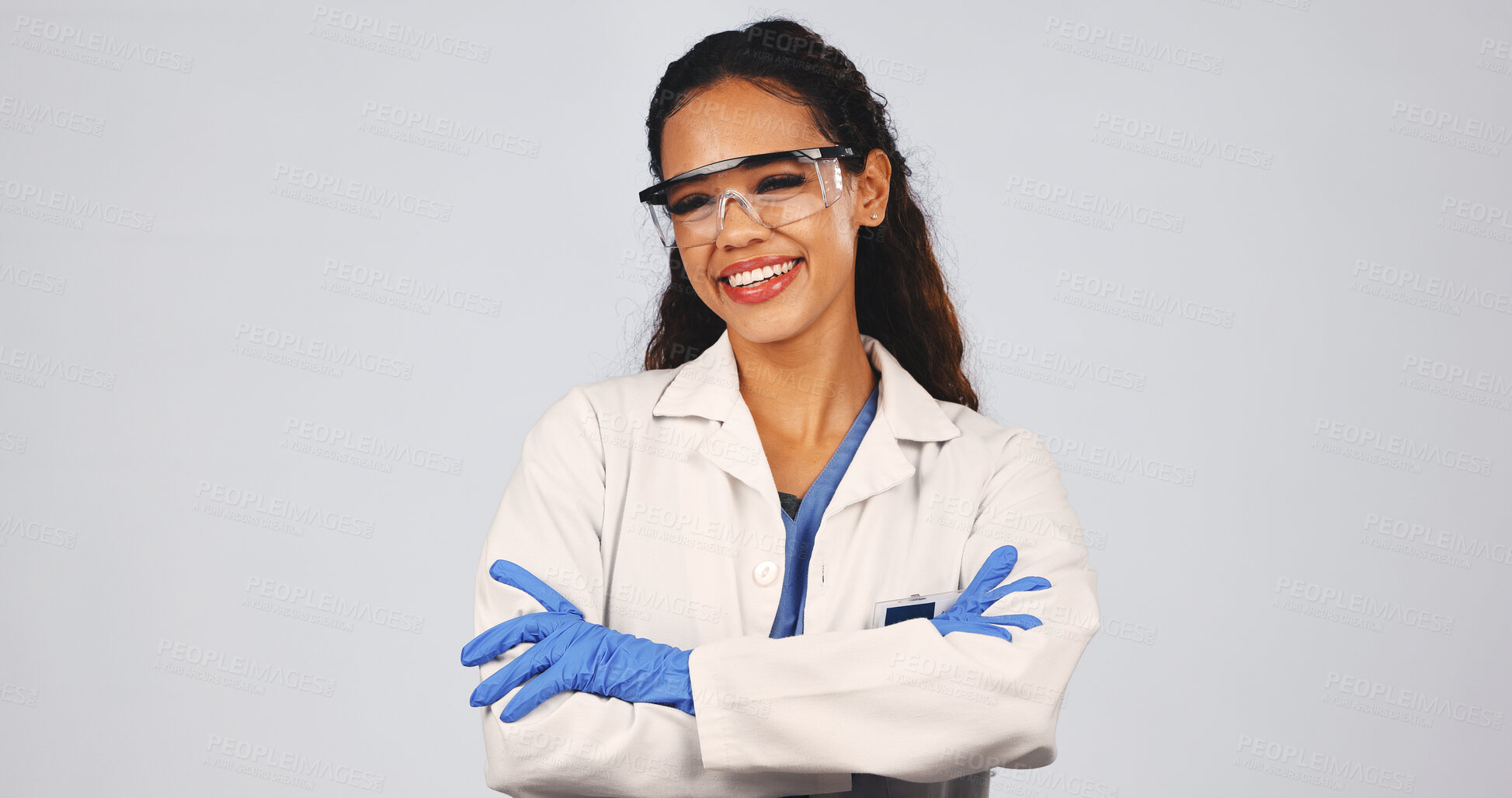 Buy stock photo Scientist, portrait of woman in studio with crossed arms, lab coat and ppe for medical research. Space, healthcare and person with protection, goggles and safety gear for science on white background