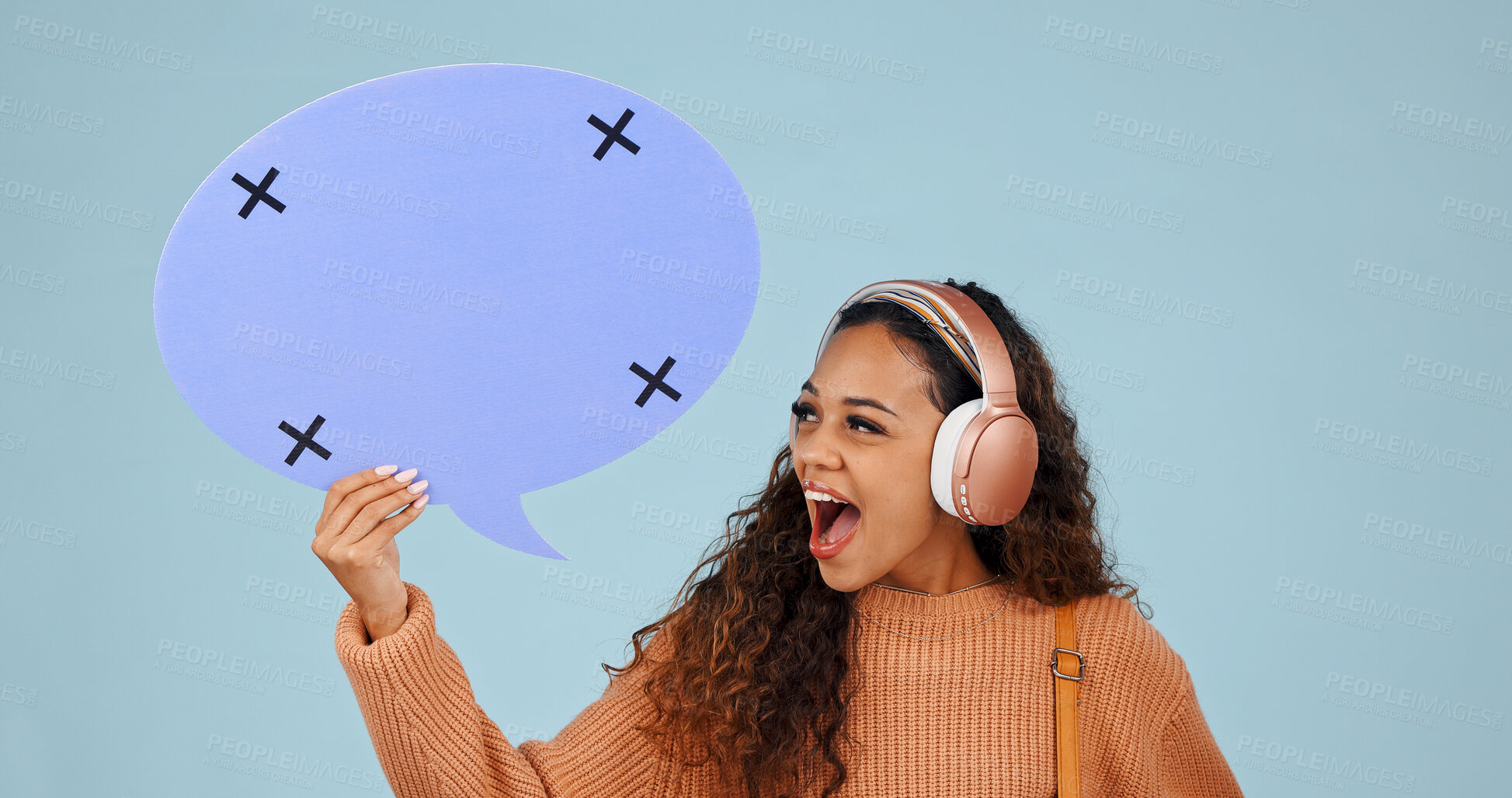 Buy stock photo Headphones, woman and speech bubble for faq, voice and shock with mockup space in studio. Excited, person and dialogue balloon for quote, surprise and streaming music with feedback on blue background