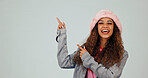 Studio, portrait and woman with promotion, pointing and excited for discount offer or recommendation. White background, space and happy person with gesture, advertising and sale deal announcement