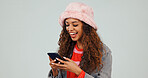 Chat, online and woman with phone in studio, laughing and communication with contact on social media. White background, texting and happy person with mobile, space and reading funny message on web