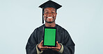 Green screen, tablet and portrait of black man for graduation with education tips, FAQ or blog in studio. Mockup space, digital technology and student with college achievement by blue background.