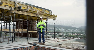 Buy stock photo Architect, thinking and man with tablet on roof, building inspection or planning for home renovation. City, architecture and black person with tech on construction site, idea and property development