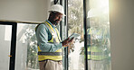 Tablet, black man and construction worker on site with inspection for building development. Digital technology, research and civil engineer with feedback on app for renovation, repairs or maintenance