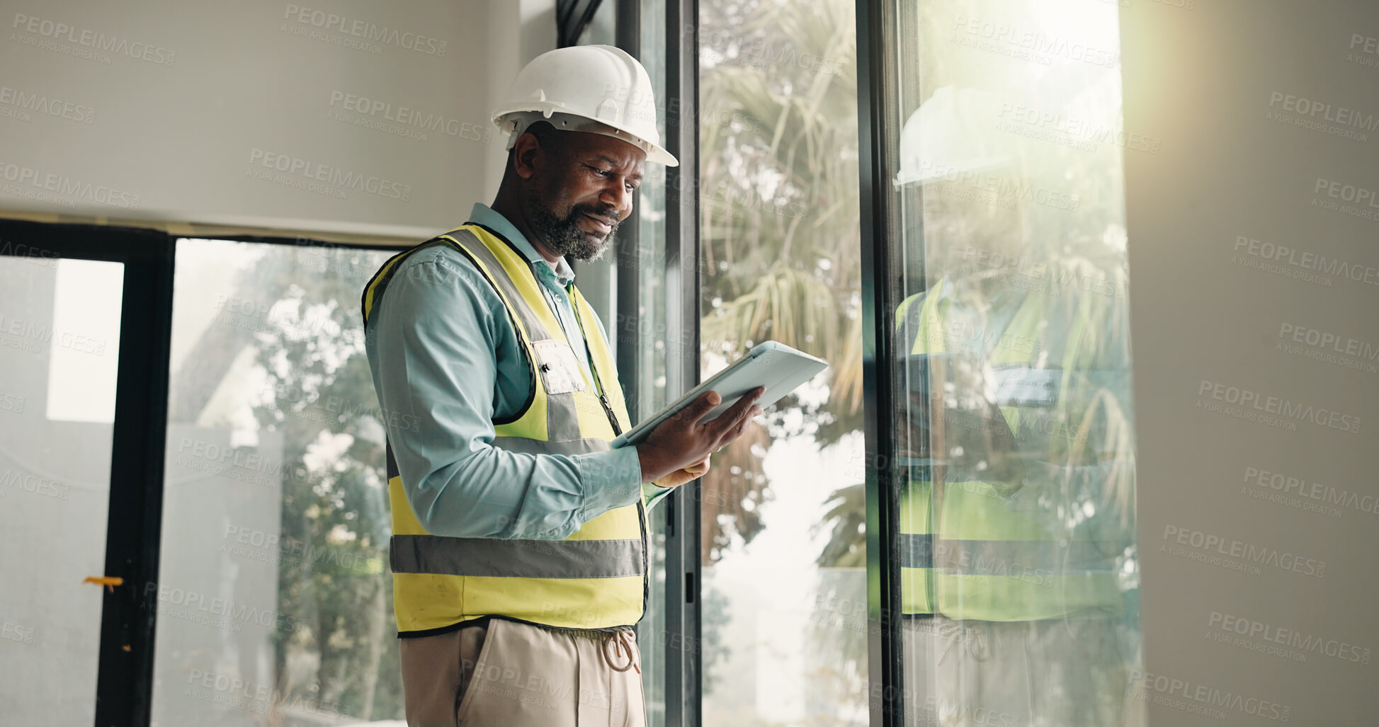 Buy stock photo Tablet, black man and construction worker on site with inspection for building development. Digital tech, research or mature civil engineer with feedback on app for renovation, repairs or maintenance