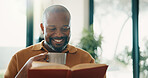 Chilling, coffee or black man in home with reading book, calm moment or literature hobby on weekend break. Happy, flare or mature person with warm drink, fantasy story or peaceful activity on day off