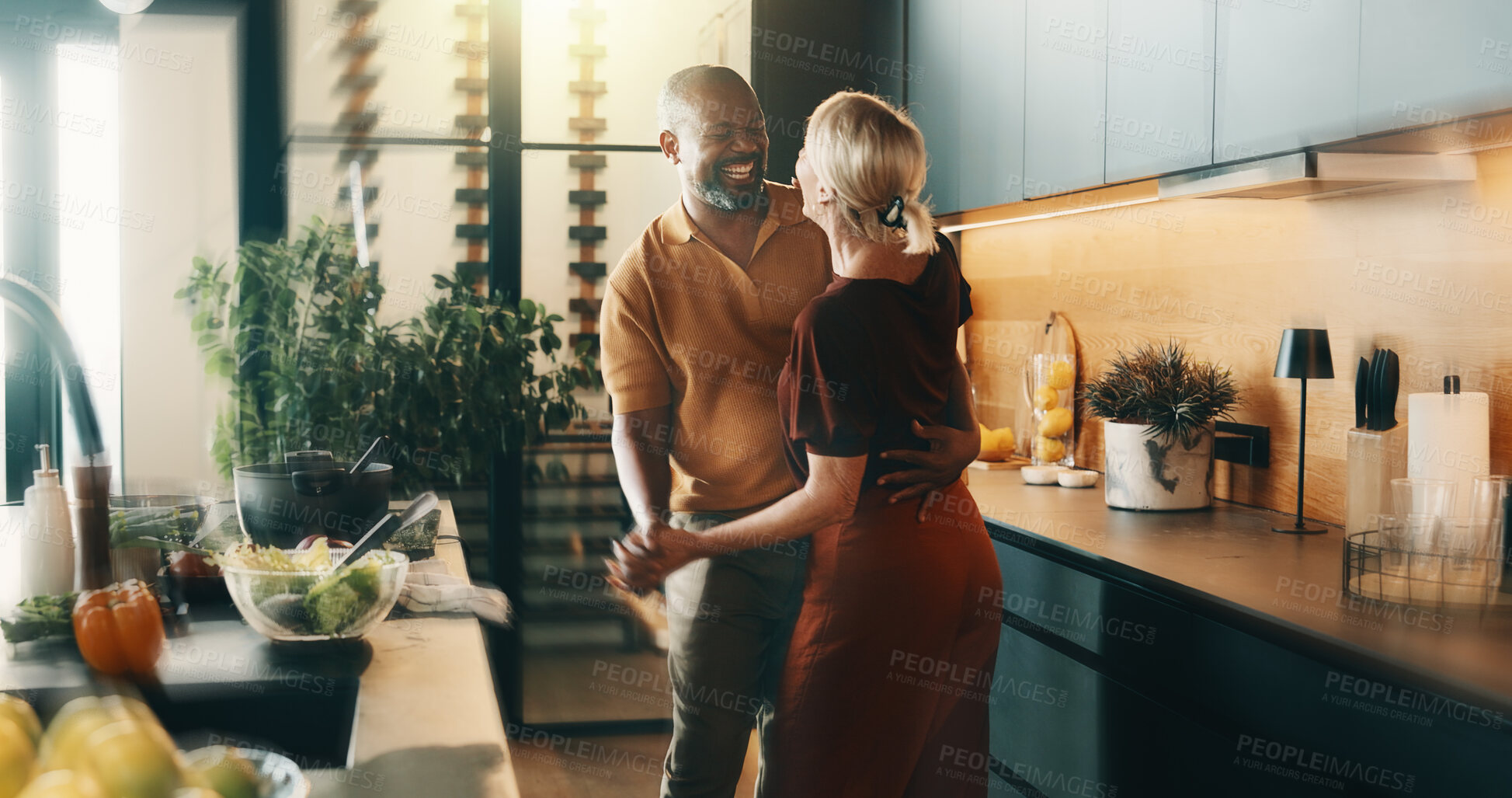 Buy stock photo Dancing, mature and couple in kitchen for cooking, bonding and love with music, song and meal prep. Home, dinner and man and woman with radio for affection, relationship and interracial marriage