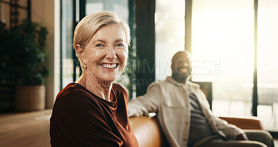 Buy stock photo Happy, relax and portrait with couple on sofa in home for bonding, weekend or holiday together. Interracial relationship, man and mature woman with smile on living room couch for break in house