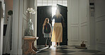 Mother, leaving and child in home with backpack, support and back to school for education. Woman, walking or front door with daughter for commute, morning routine and bonding together for learning