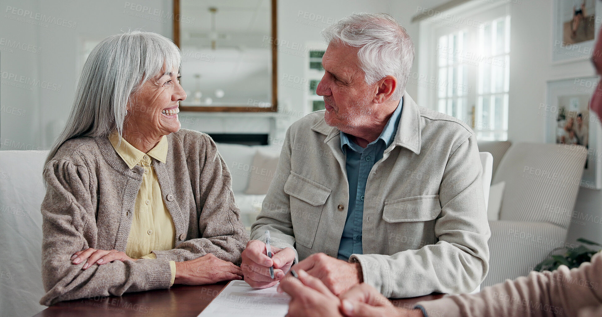 Buy stock photo Financial advisor, paperwork and senior couple in home, smile and application for loan contract. Man, woman and consulting for pension fund, retirement investment and happy with annuity plan in house
