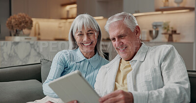 Buy stock photo Senior, home and happy couple with tablet on sofa for entertainment, network or online app. Elderly, man and woman with smile or technology for streaming, internet or connection together in house