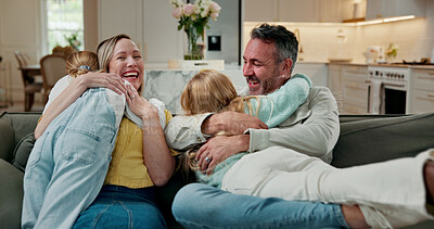 Buy stock photo Family, hug and sofa with children in home for bonding, playful weekend or holiday together. Mom, dad and playing with kids, smile or embrace on couch for love, support or happy childhood in house