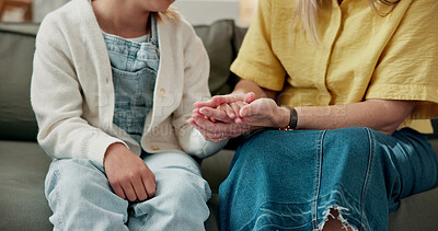 Buy stock photo Parent, holding hands and comfort for child in lounge, connection and bonding with daughter on break. Family, love and kindness with gesture, support and person with kid, empathy and trust in home
