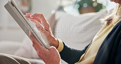 Buy stock photo Hands, old woman and relax in home with tablet, social media and streaming movies in lounge. Senior person, scroll and rest at house with digital, browsing website and download games in living room