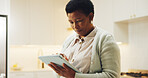 Ebook, search or black woman in house with tablet, online library or scroll on storytelling platform. Digital, space or mature person with tech, virtual browse or portable reading on literature site.