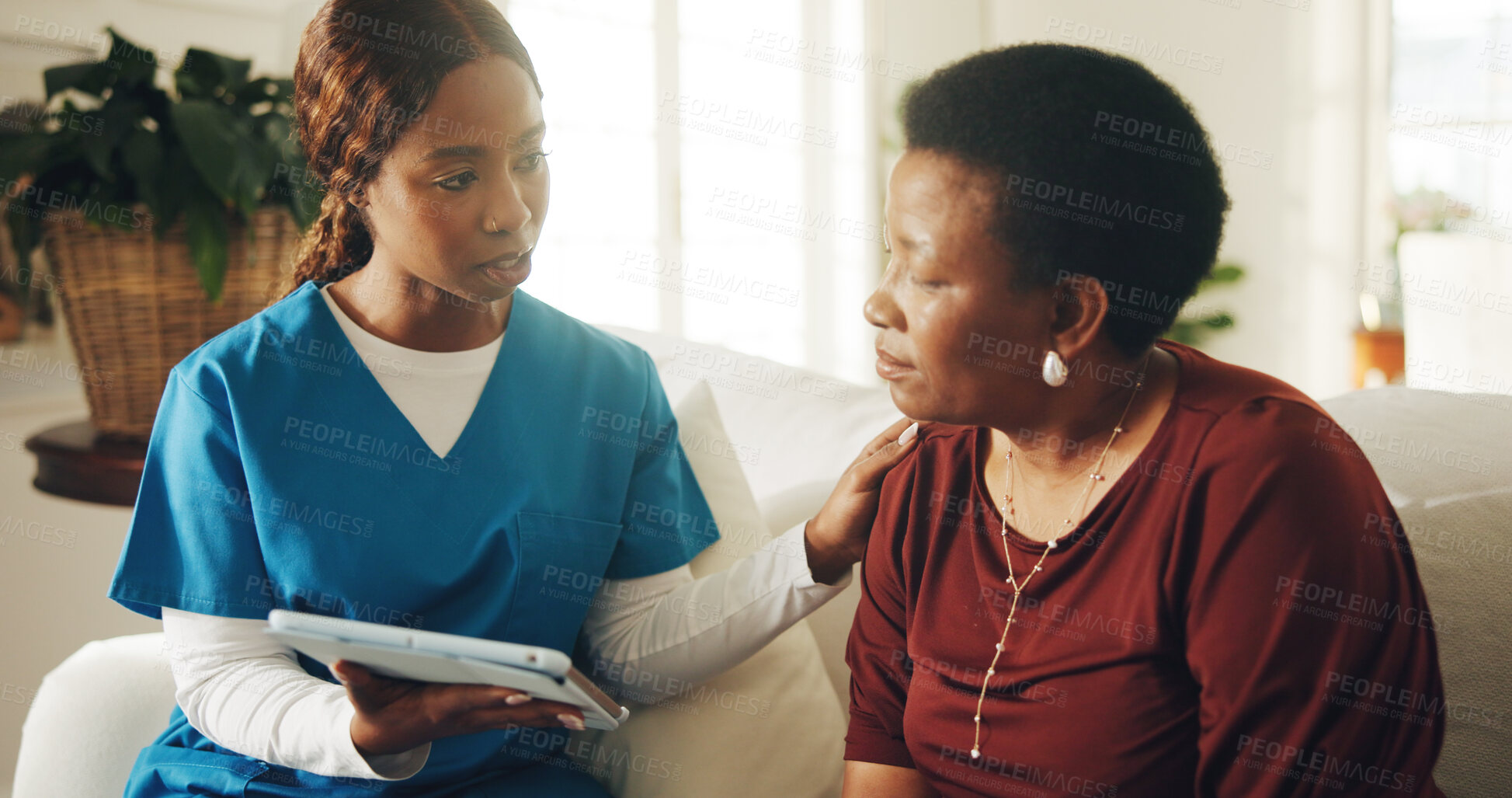Buy stock photo Patient, support and nurse in home with tablet, medical test results and conversation for diagnosis. Mature woman, black people and discussion on sofa with tech, healthcare advice and comfort