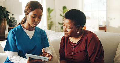Buy stock photo Patient, consultation and nurse in home with tablet, medical test results or discussion for diagnosis. Mature woman, black people and talk on sofa with tech, healthcare worker or advice for wellness