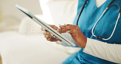 Buy stock photo Nurse, hands and typing in clinic with tablet, medical research and browsing for health insurance. Woman, healthcare worker and scroll with tech, telehealth website or digital app for hospital cover.