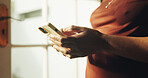 Text, chat and hands in house with phone, online communication and post reaction on social media app. Digital, typing and woman with technology, message update or networking on virtual platform.
