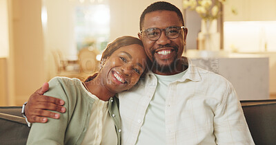 Buy stock photo Care, portrait and hug with black couple in home with support, happiness and relationship security. Smile, man and woman embrace in lounge with partner for love, commitment and connection together