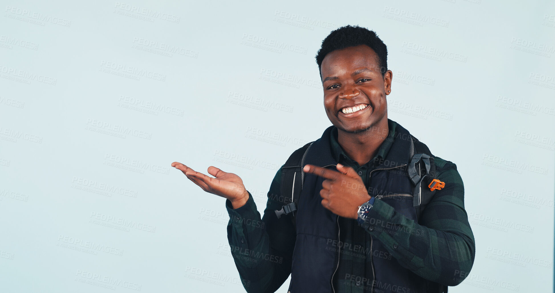 Buy stock photo Student, portrait and happy man with promotion, point and marketing academic opportunity and advice. Studio, white background and black person with college suggestion, mockup space and advertising