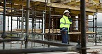 Happy, black man and engineer at site with phone call, discussion and inspection for construction. Smile, person and talking on rooftop with mobile, planning and compliance update for building safety