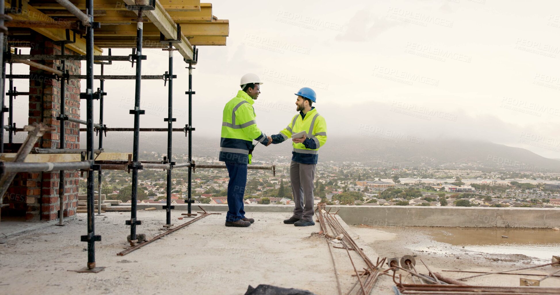 Buy stock photo Men, handshake and tablet on construction site for agreement, development deal or welcome. Engineer, space and team shaking hands with tech for partnership and renovation collaboration at scaffolding