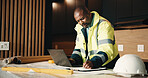 Architect, man and writing in house with laptop, renovation cost and invoice for property upgrade. Mature, black person and computer in apartment for architecture, notes and remodeling project quote.