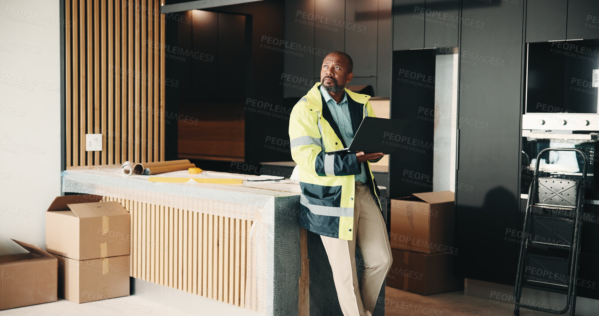Buy stock photo Architect, man and thinking in home with laptop, renovation research or consider property upgrade. Mature, black person and computer in house for architecture, problem solving and remodeling project.