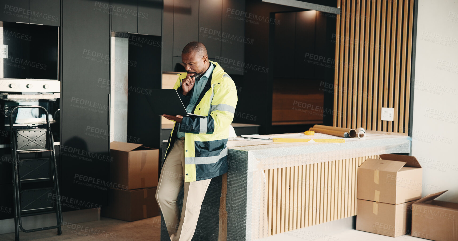 Buy stock photo Architect, man and thinking in new house with laptop, remodeling design and property development. Mature, black person and computer in home for architecture, problem solving and renovation project.