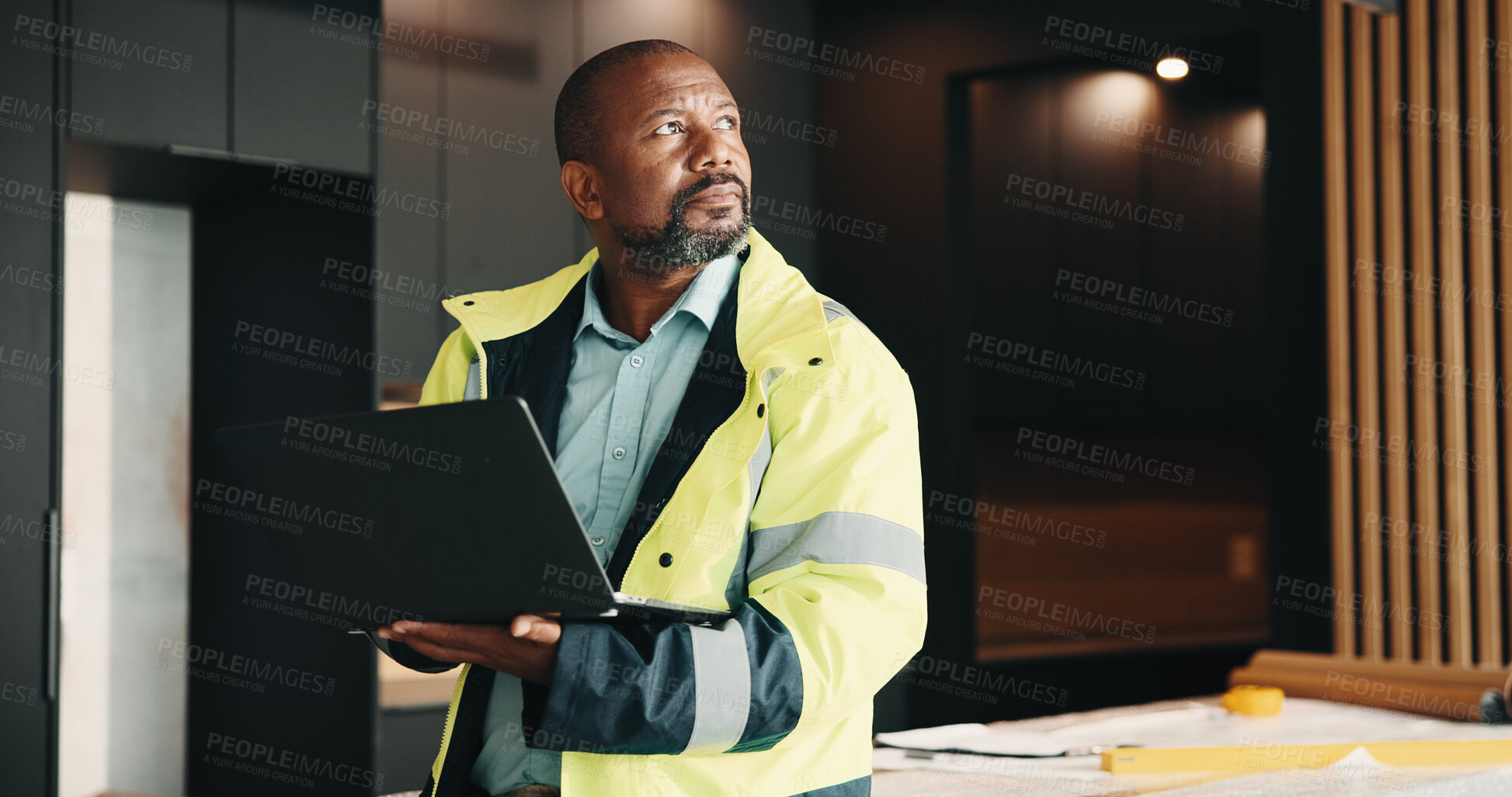 Buy stock photo Architect, thinking and black man in home with laptop, renovation idea or consider property upgrade. Mature person, plan and computer in house for architecture, work or vision for remodeling project.