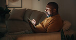 Tablet, shock and black man in home at night for reading blog on budget, savings and investment planning. Technology, research and mature person with surprise on app for financial tips or advice.