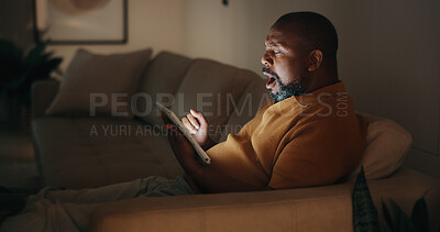 Buy stock photo Tablet, shock and black man in home at night for reading blog on budget, savings and investment tips. Technology, research and mature person with surprise on app for financial planning or advice.