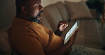 Tablet, yawn and black man in home at night for reading blog on budget, savings and investment planning. Digital technology, tired and mature person on app for financial tips, advice or guidance.