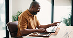 Laugh, laptop and black man in home with remote work for sustainability law case with email. Pointing, computer and mature environmental attorney with pro bono project for freelance career in house.