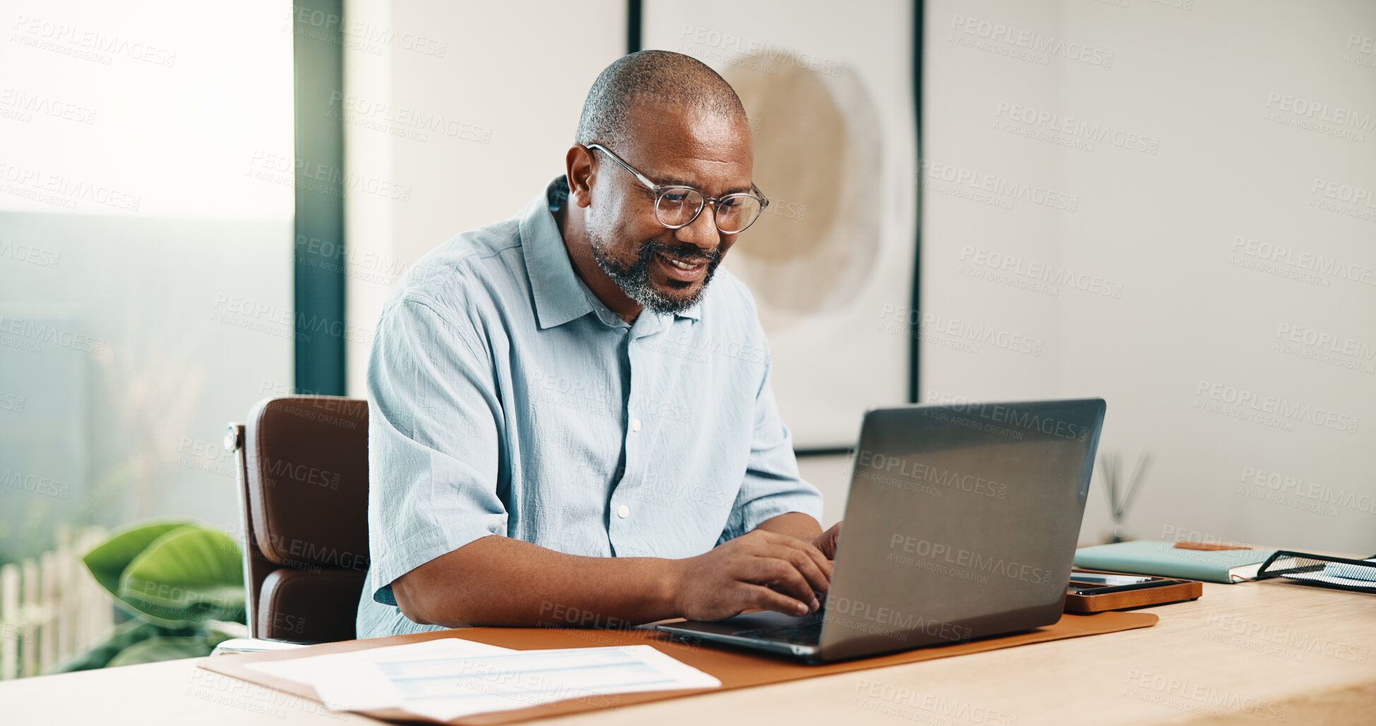 Buy stock photo Remote work, feedback or black man in home office with laptop, research or budget insight for funding. WFH, happy or mature finance advisor with tech, forecasting or proposal update for investment.