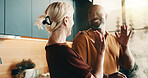 Cooking, high five and smile with interracial couple in kitchen of home together for meal preparation. Bonding, love and success with mature people in apartment for culinary goals, hobby or target