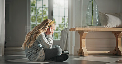 Buy stock photo Thinking, sad and child in home on floor with loneliness, trauma or reflection for bad memory. Pensive, kid and girl with depression in apartment, mental health and deep thoughts with anxiety