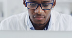 Laptop, black man and scientist in laboratory with glasses for medical research online. Professional, reading and African male biologist with online report on pharmaceutical study with computer.