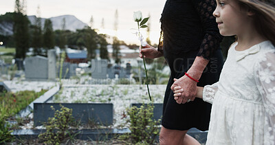 Buy stock photo Holding hands, mother and girl in graveyard, sad and emotions for grief, bereavement and loss. Family, parent and daughter with support for funeral, people or burial for death, comfort or compassion
