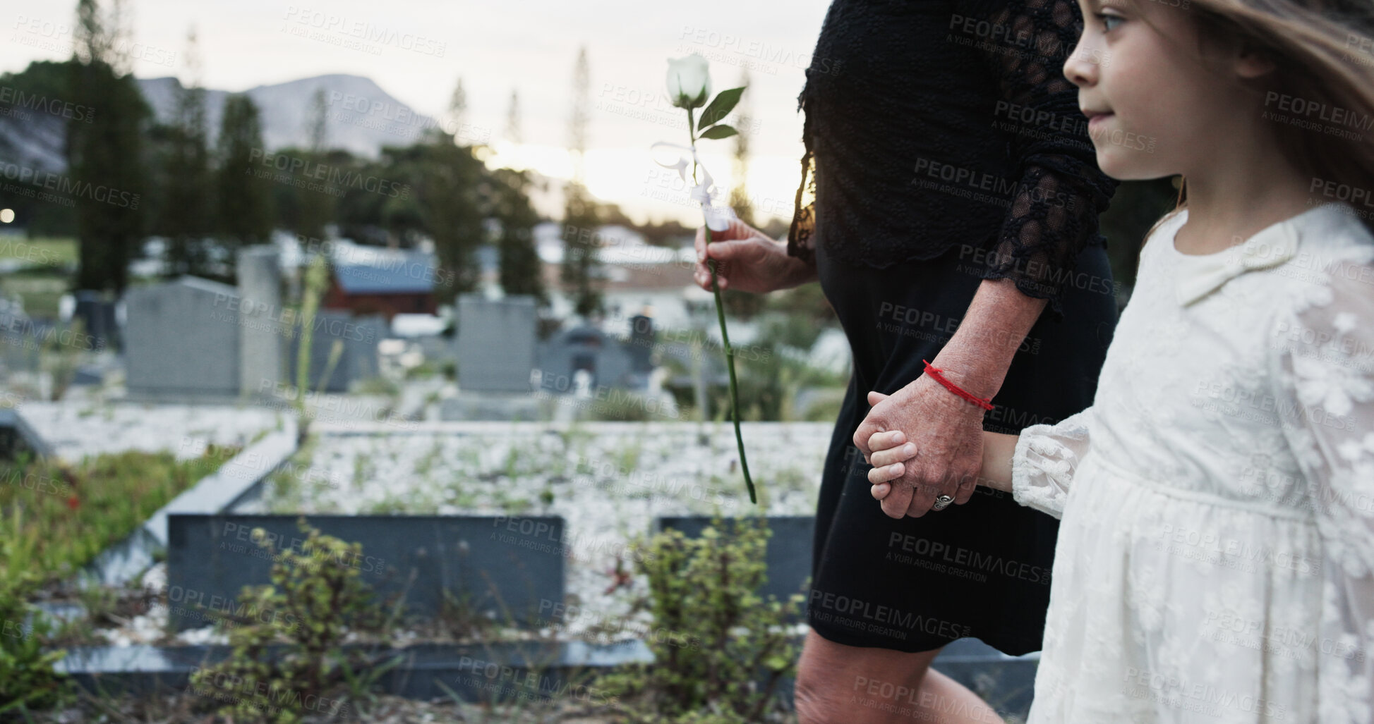 Buy stock photo Holding hands, mother and girl in graveyard, sad and emotions for grief, bereavement and loss. Family, parent and daughter with support for funeral, people or burial for death, comfort or compassion