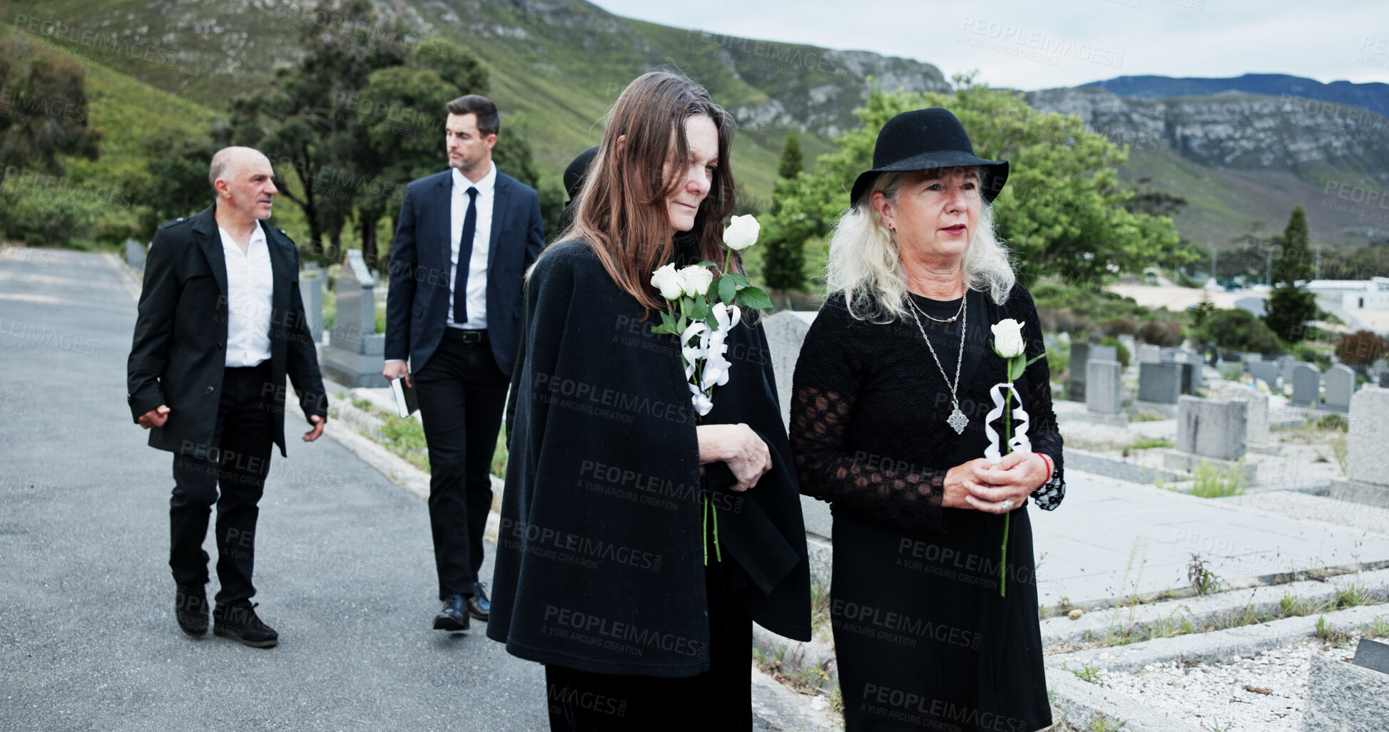 Buy stock photo People, sad and flowers in graveyard, support for funeral and mourning for loss. Cemetery, women and family with compassion, grief and burial for death ceremony, memorial service and remembrance