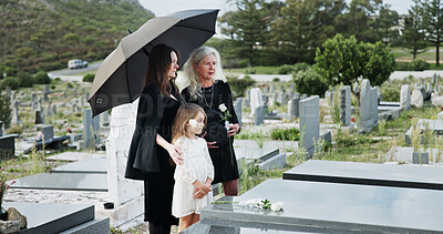 Buy stock photo Family, funeral and rose with respect in cemetery for grief or mourning death together in graveyard. Women, child and empathy with flowers or offering for farewell, burial or ceremony on tombstone