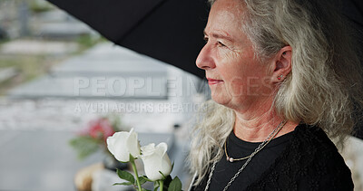 Buy stock photo Elderly, woman and umbrella at cemetery with flowers, grieving loved one and thinking about past memory. Sad, old person and reflection at graveyard outdoor with roses, mourning and sorrow for death.