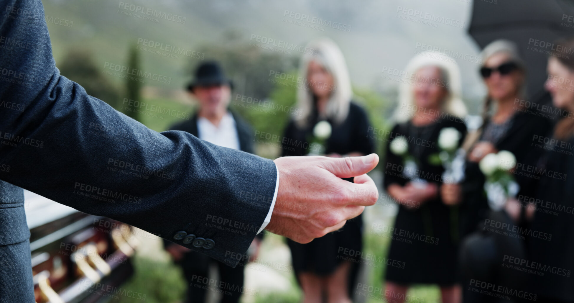 Buy stock photo Person, pastor and praying with family in funeral for memorial service or worship of god. Speaker, people or priest with voice, faith or moment of silence at graveyard or cemetery for death or burial