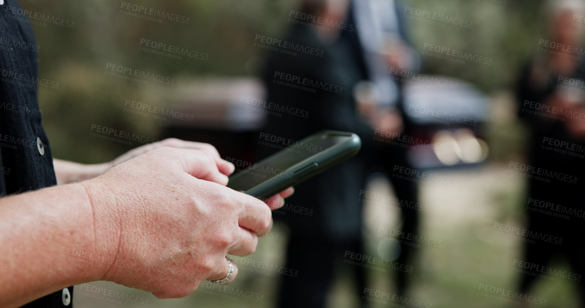 Buy stock photo Funeral, hands and woman in graveyard, smartphone for online chatting and post for memory. Family, mobile user and person in cemetery, cellphone and message to contact, connection and communication
